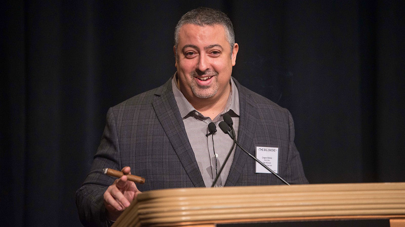 Gregory Mottola introduces the panel of cigarmakers.