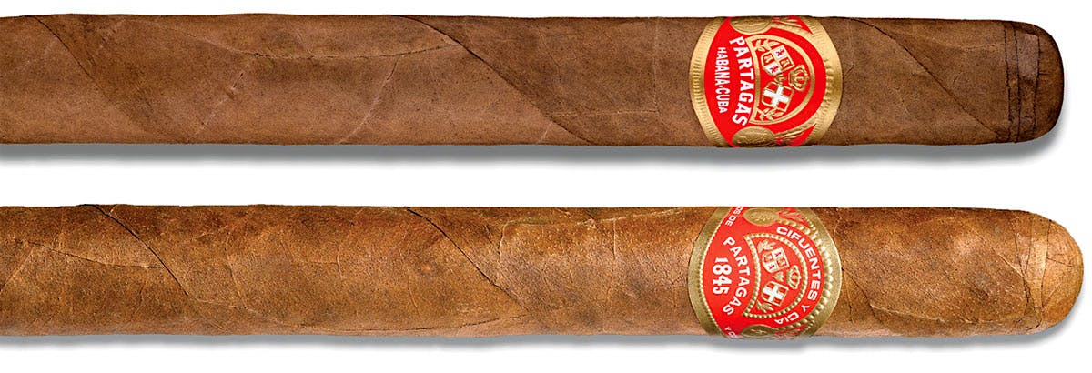 A Cuban Partagás next to one of the non-Cuban versions, which is rolled in the Dominican Republic.