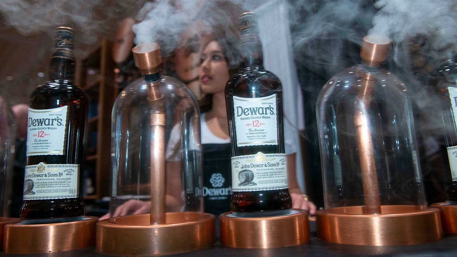 Dewar's brings a little smoke of its own. These vapors emit the aroma of its fine Scotch.
