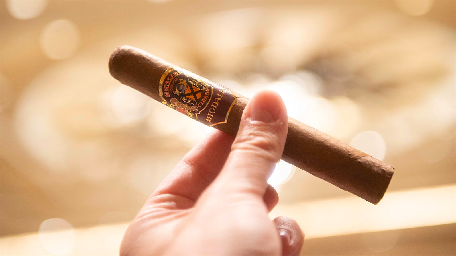 The crowd then receives a Micallef Migdalia Toro, a new cigar that is not yet on the market.