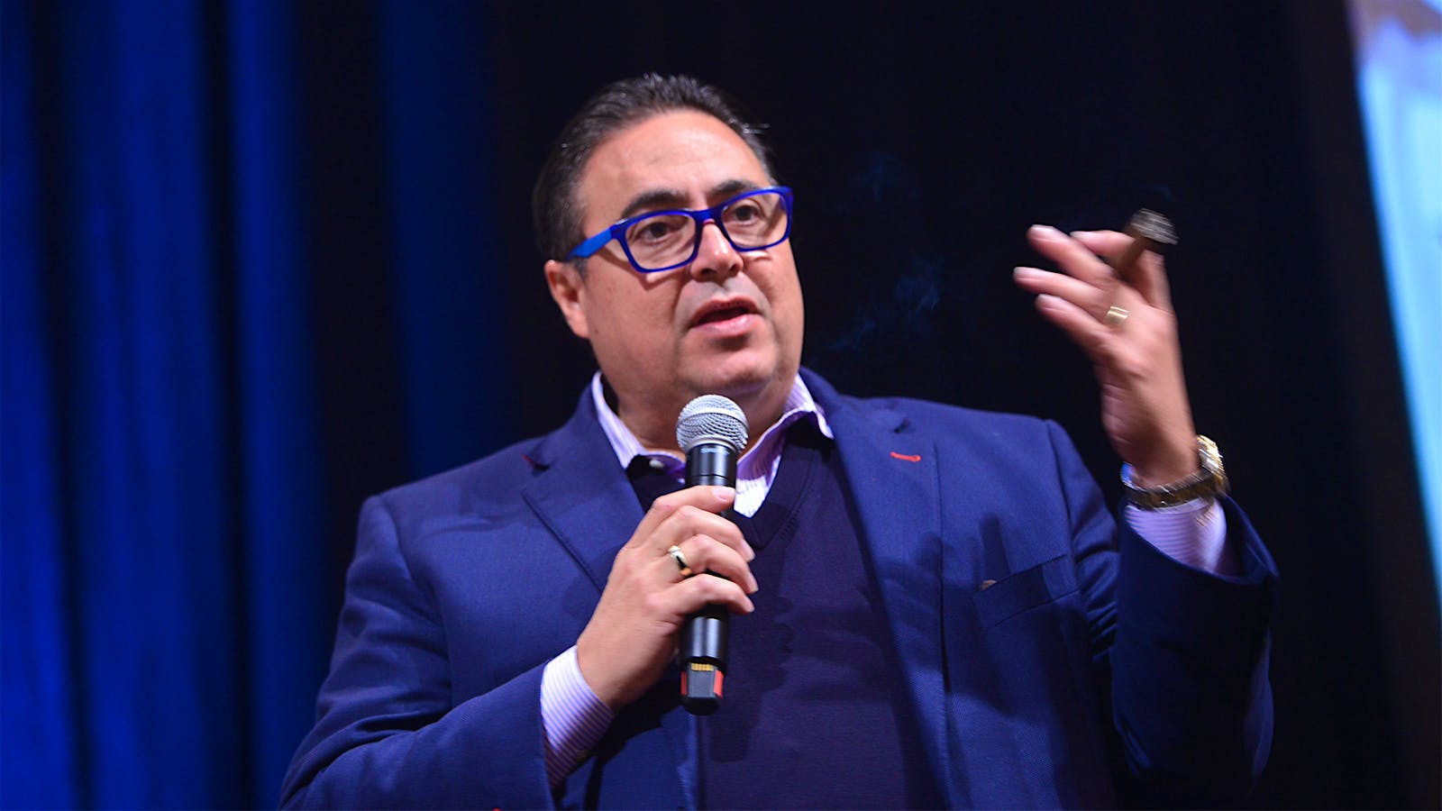 Rafael Nodal, head of product capability at Tabacalera USA, steps up to the podium to speak about the cigars.