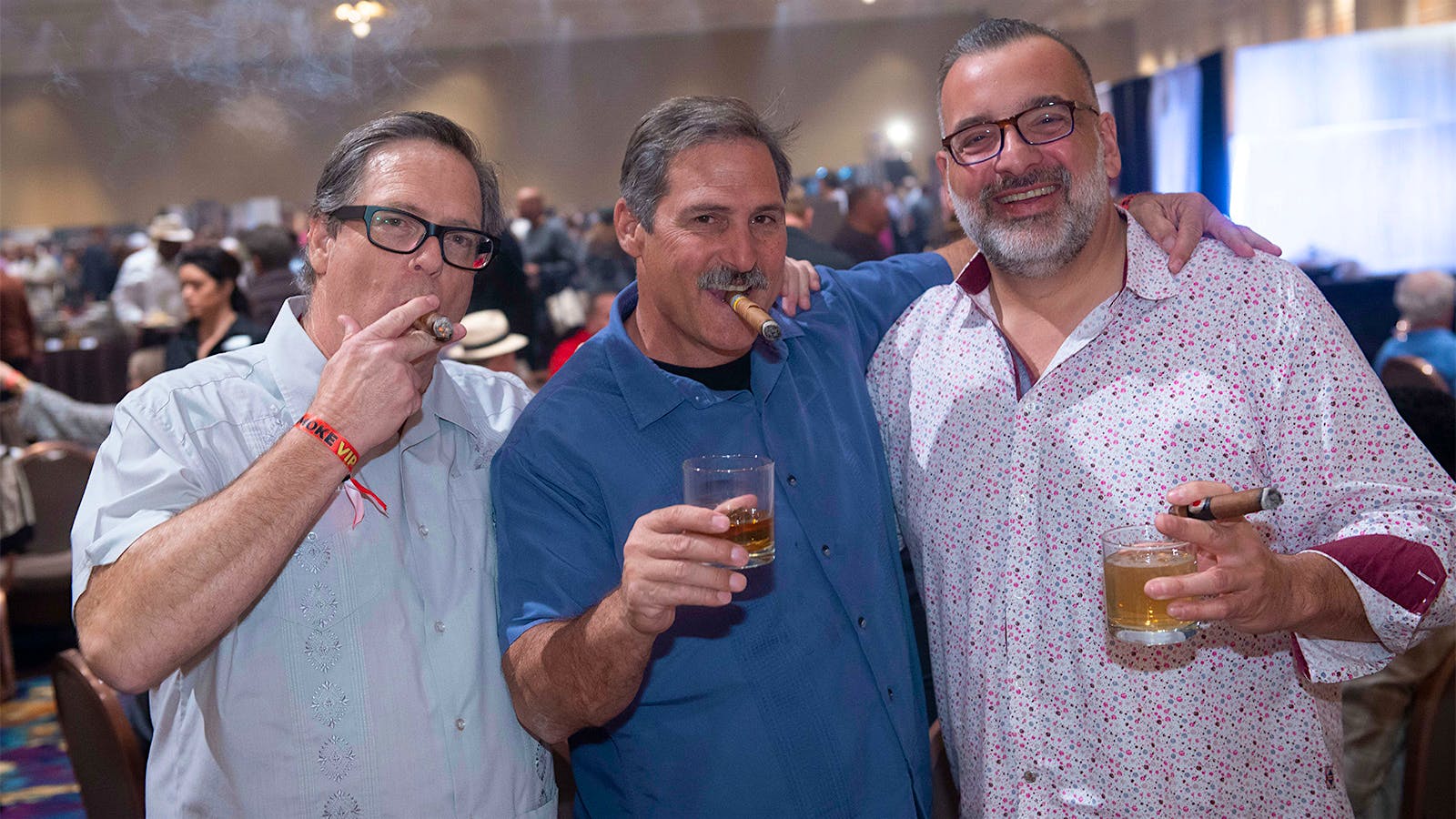 Geoff Malais, Greg Malais and Paul Gallegos are all cheers as they relax with cigars.
