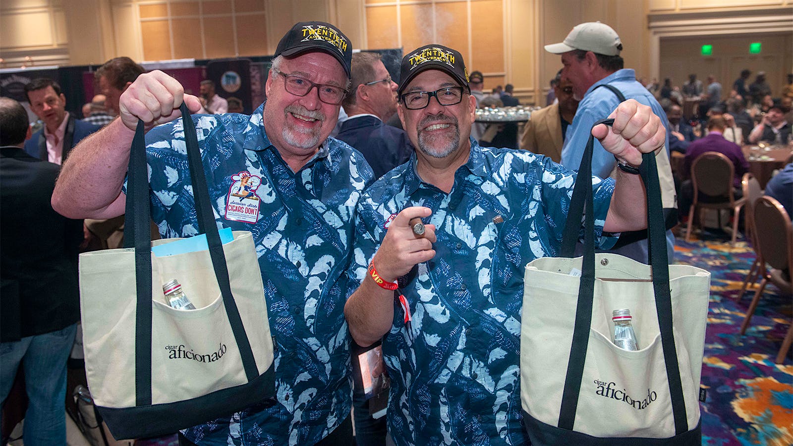 Rick Denison and Santino Failla look like kids on Halloween with all the new cigars in their bags.