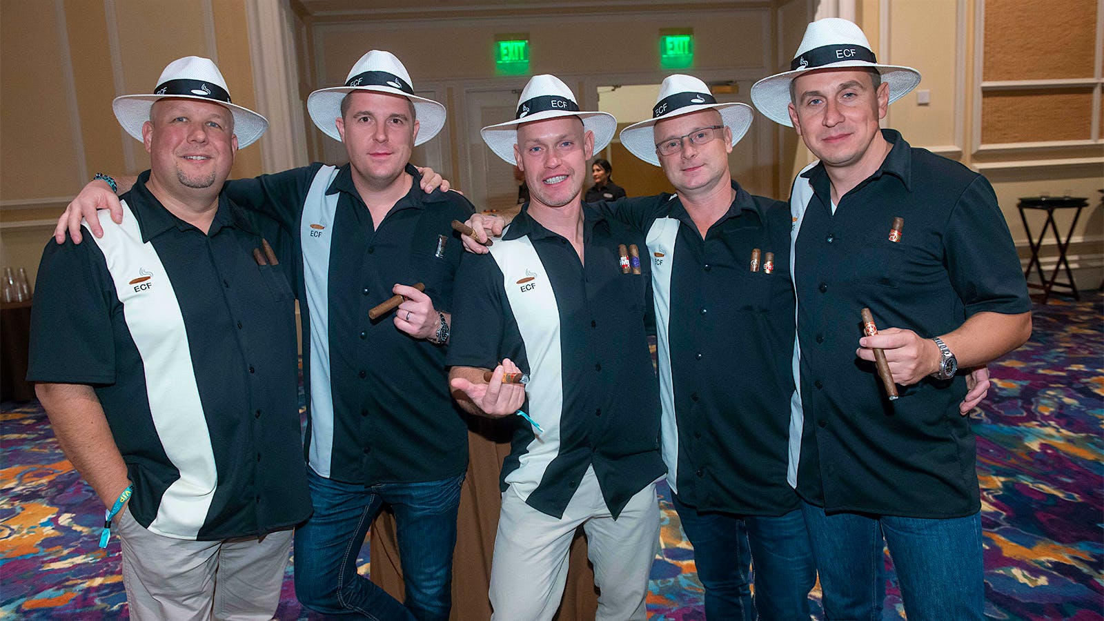 The ECF cigar crew, who traveled all the way from Hungary to attend the Big Smoke, don sharp shirts and Panama hats.