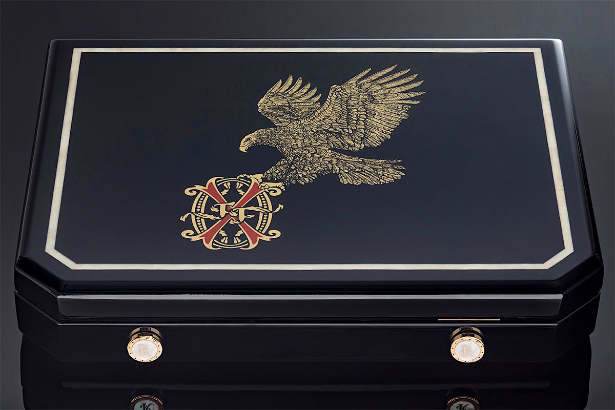 The exterior of the OpusX by Stefano Ricci travel humidor features an Australian Mother of Pearl inlay and black lacquered finish.
