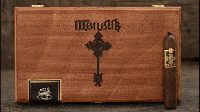 Menelik is a soft-pressed petit robusto with a pigtail that measures 4 1/2 inches by 52 ring gauge.